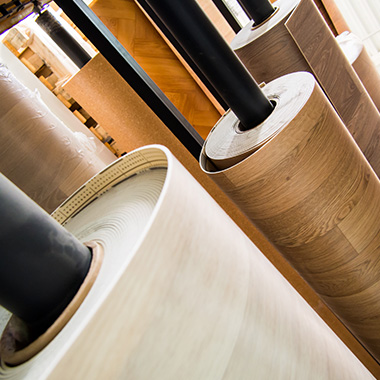 rolls of vinyl flooring in a shop